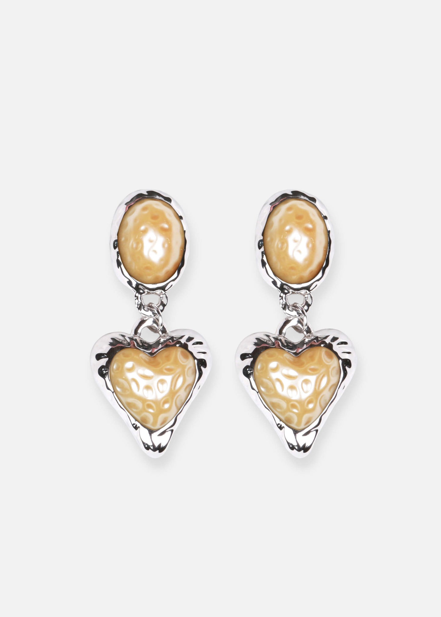 Vintage-inspired pearl heart drop earrings. Rhodium-plated brass, lightweight design. Support sustainability!